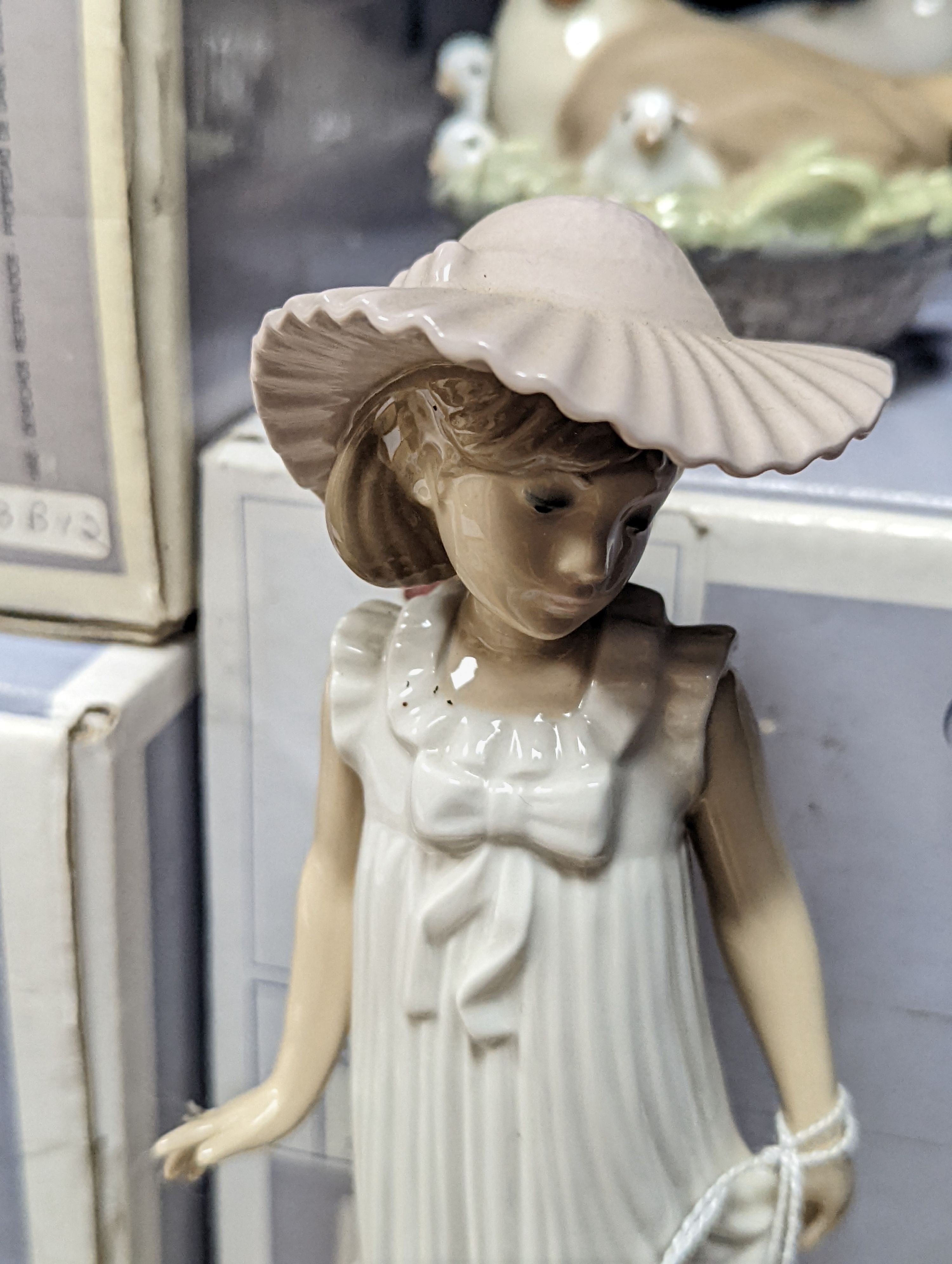 A selection of Lladro and Nao figures